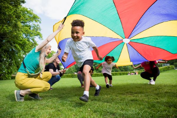 Adults and children playing 