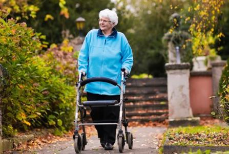 elderly woman with walking frame