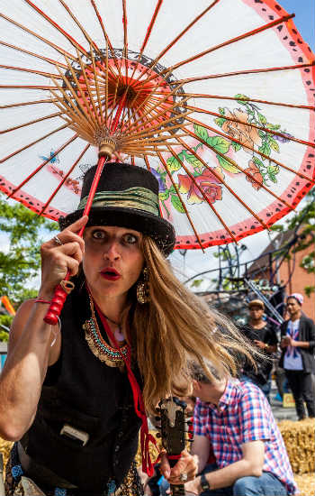 Artist in costume with parasol