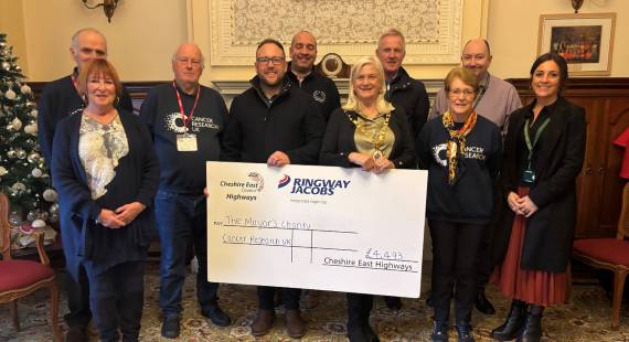 Representatives from Cheshire East Highways and Cancer Research UK Crewe and Nantwich Committee with Cllr Marilyn Houston as the cheque is handed over