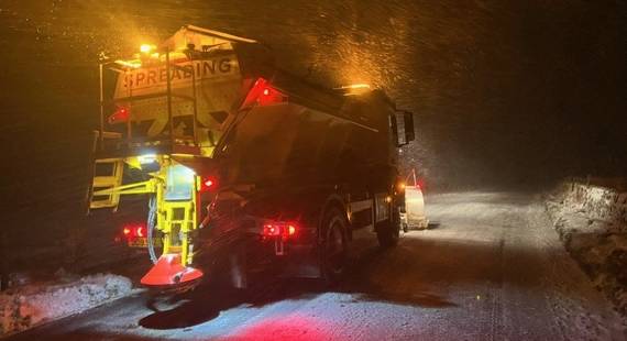 A gritter out at night