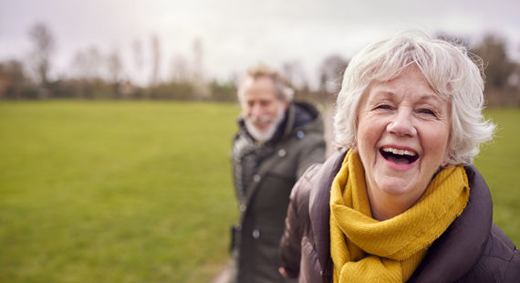 Happy older couple out walking 570 x 310