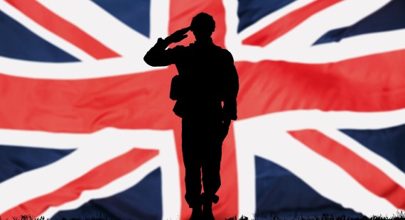 Silhouette of a soldier in front of a British flag