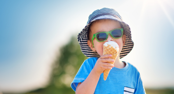 Young boy eating ice cream on a summer day 570 x 310