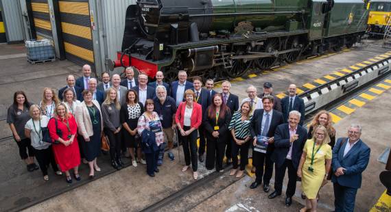 Rail Minister Wendy Morton MP, centre, visited Crewe to hear why Crewe is the ideal location for the headquarters of Great British Railways, Pictured with local politicians and stakeholders at Locomotive Works.